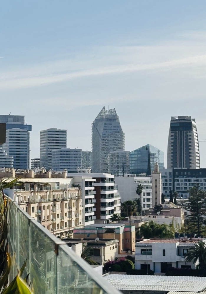 A modern city skyline — the group's wider footprint includes a related entity operating in Australia.