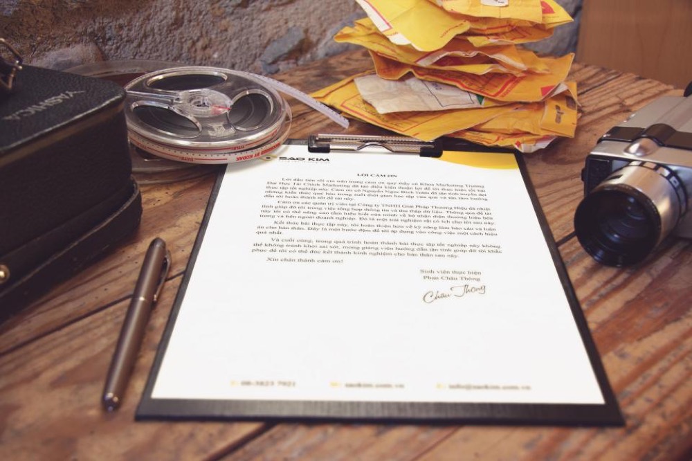 A signed business loan agreement on a desk — the agreement is between Credicorp and your company.
