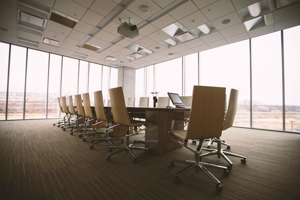 A calm, well-lit boardroom table ready for a meeting — working capital that lets a UK company act on its next move.