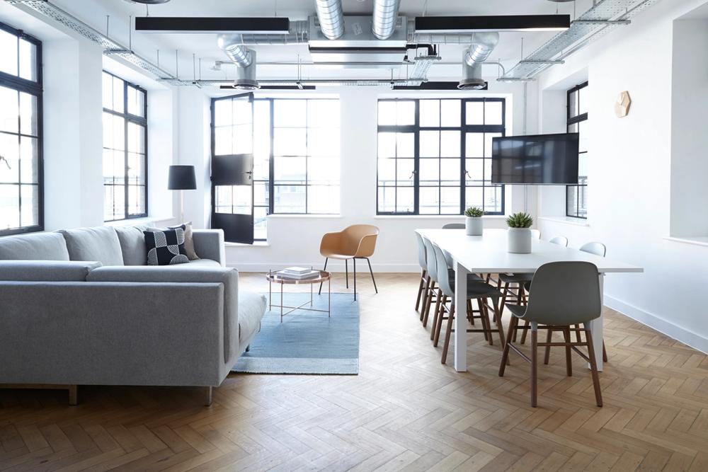 A relaxed cafe and bar interior set up before opening — the kind of room a hospitality refit or refresh pays for.